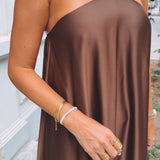 VIVIENNE BROWN SATIN HALTER DRESS
